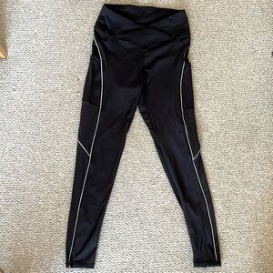 Black Spandex Leggings with Silver Accents, Pockets, and Crossed Pattern Waist
